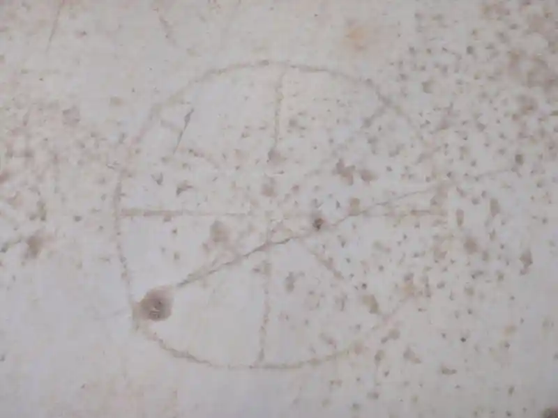 Solar cross on a marble stone in the ruins at the Curetes Street, Ephesus Izmir